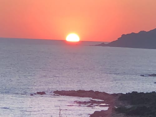Sunset over the Mediterranean Sea at Villas Marincelu in Serra di Ferro, Corsica