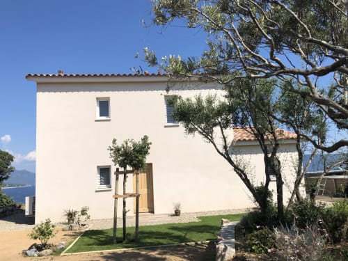 Casa Alta villa at Villas Marincelu in Corsica with white facade, terracotta roof, olive trees, and sea view