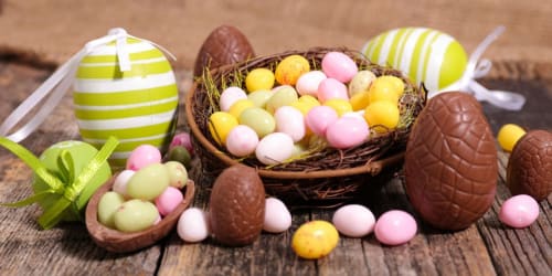 Easter chocolates and pastel eggs displayed with ribbon at Château d'Hassonville, a Marche-en-Famenne Belgian bed and