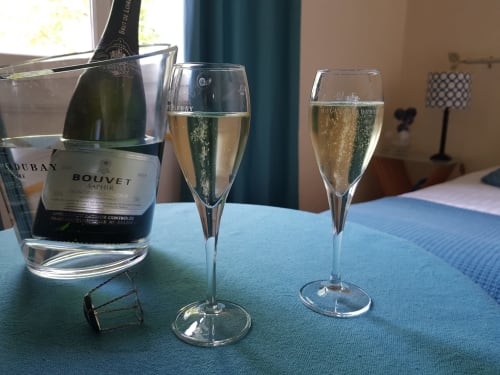 enjoy a bottle of Crémant de Loire in your room