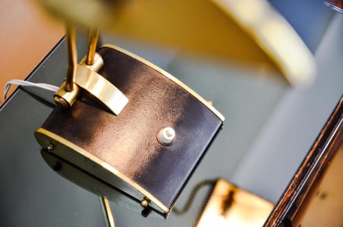 Luxury bedside lamp with gold and black finish at Mas De Lafeuillade boutique hotel in Montpellier