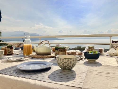 Breakfast table on villa terrace overlooking Corsican sea and mountains, Villas Marincelu Porto Pollo