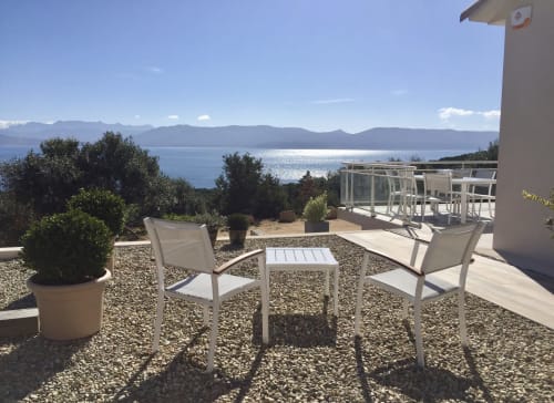 Sea view terrace at Villas Marincelu villa in Serra di Ferro with lounging area overlooking bay