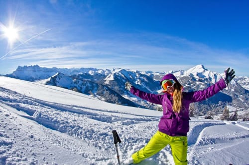 Skier on slopes of Châtel, winter, snow, peaks of Dents-du-Midi and Mont-de-Grange, Portes-du-Soleil.