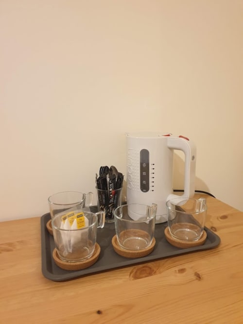 Coffee station with kettle, glasses, and utensils in Cérise room at Villa Thébaïde, Laudun L'Ardoise