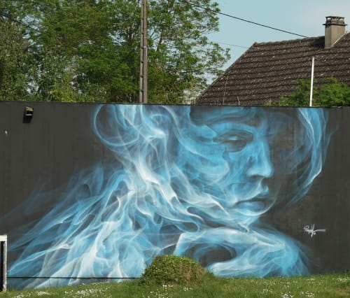 Blue ethereal mural artwork on dark wall at Château De Clusors B&B in St Menoux, France