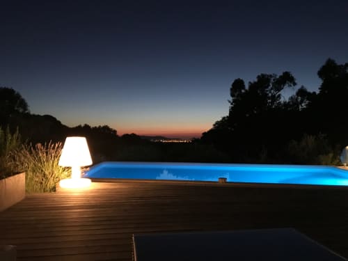 Villa Limone swimming pool at night with view of illuminated CALVI.