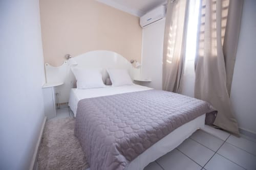 Lit double. Carambole. Locastudio. Locations Appartements. Guadeloupe.