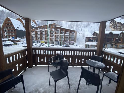 Snowy mountain terrace at Le Champenois apartment, Hermonville ski resort with alpine village views