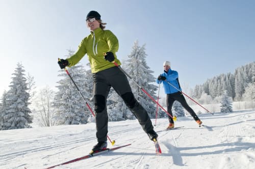 Cross-country skiers enjoying snowy forest trails near Le château d'Hermonville, Hermonville, France