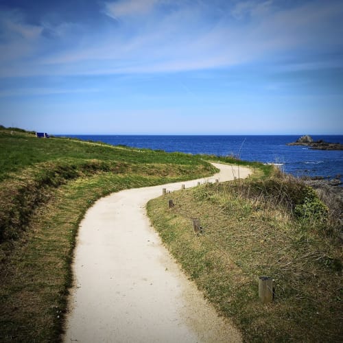 Coastal path leading to blue sea near Gîtes du Bulz, Pleyber-Christ, Brittany