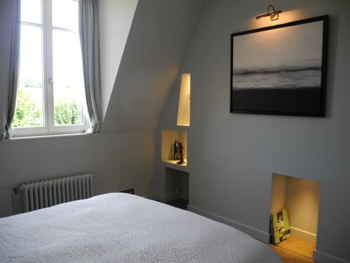 Modern bedroom at Le château d'Hermonville B&B in Hermonville, France with window, bed, and framed artwork