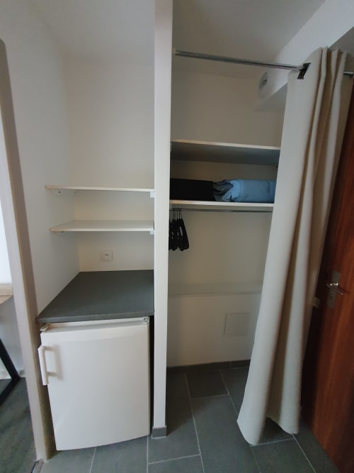 fridge in the room - rental near the iron man