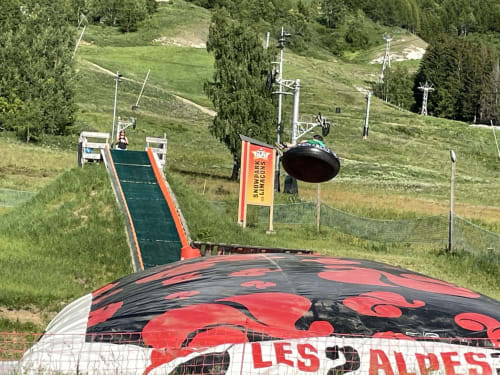 Alpine slide attraction with red and black design at Le château d'Hermonville, Hermonville France