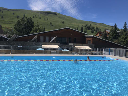 Olympic-size swimming pool at Le château d'Hermonville in Hermonville, France, with mountain views and modern facility