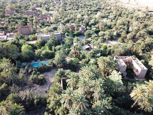 Aerial view of the Skoura palm grove. Aerial view of L'Ma Lodge. Best accommodation in Skoura. Best guesthouse in the Skoura palm grove. Charming guest house in Skoura. Secret holidays in Morocco. Original holidays in Morocco.