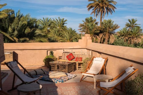 L'Ma Lodge terrace overlooking the palm grove of Skoura and the High Atlas room with view oasis of skoura ouarzazate morocco
