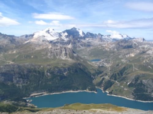 Alpine mountain landscape with turquoise lake near La Maison De L'Épine, Aime la Plagne