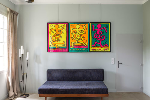 Modern bedroom at Mas De Lafeuillade Montpellier with colorful pop art above blue couch