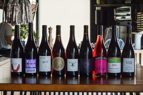 Selection of wines displayed on counter at Mas De Lafeuillade B&B in Montpellier, France