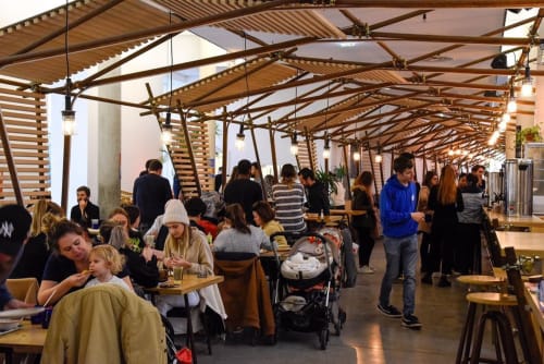 Guests dining on covered terrace at Mas De Lafeuillade B&B in Montpellier, France