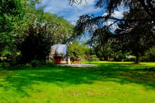 Glamping bubble accommodation in lush gardens at Aux Prés Du Berry, a French countryside B&B near Chavin.