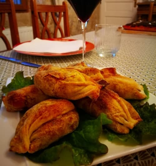 Golden fried plantain appetizer with green garnish at Aux Prés Du Berry, a French bed and breakfast in Chavin