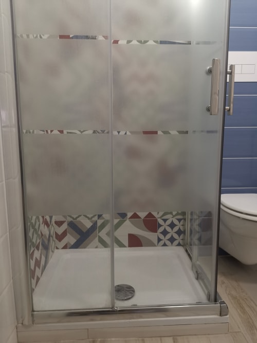 Modern glass shower enclosure with decorative tile accents in Apartment Sea at Casa Vacanze Del Golfo, Castellammare del