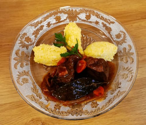 Braised beef with yellow dumplings and red peppers at Aux Prés Du Berry, Chavin, France