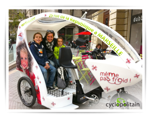 Family in Cyclopolitain bike taxi at Châtillon, Marseille - eco-friendly transport service