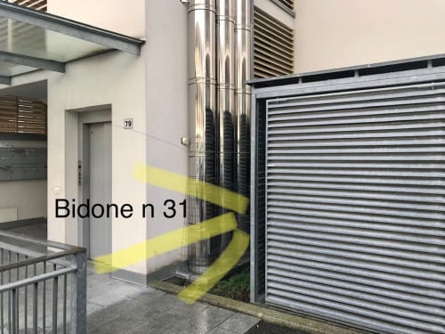Bidone n31 apartment entrance with yellow safety marking, Gargazzone location