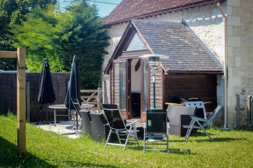 View from the garden to the Angel arche house, Maison les arches de Muschamp, Cussay, France. 