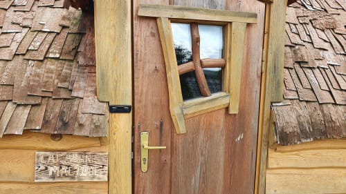Entrance door of the magic hut, unusual accommodation, Les refuges du chalet, Belgium. 