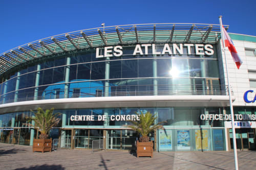Les Atlantiques convention center in Les Sables-d'Olonne, France with modern architecture and palm trees