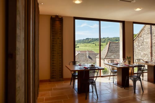 Modern cottage workspace with vineyard views at Les Maisons de Chamirey, Mercurey, featuring work desks and stone