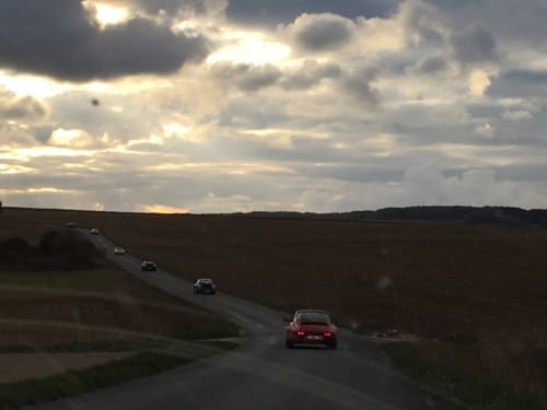 Scenic countryside drive near Le Petit Château in Baye, France with dramatic cloudy skies
