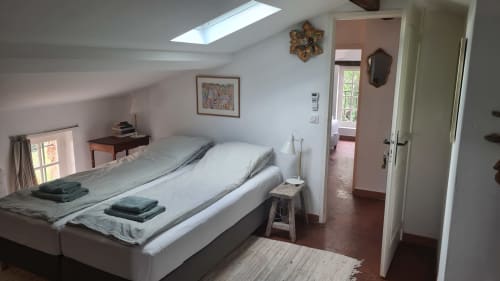 Bright attic bedroom at La Sentinelle B&B in Les Arcs sur Argens with skylight, twin beds, and mountain views