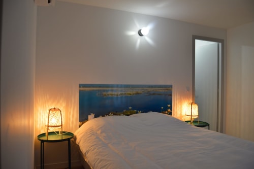Bedroom with river view at Locacharme cottage in Blois, ambient lighting, modern decor