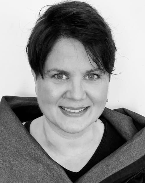Smiling portrait of Sandra Schmitt your host for Le Clos d'Azel bed and breakfast in Alsace, France
