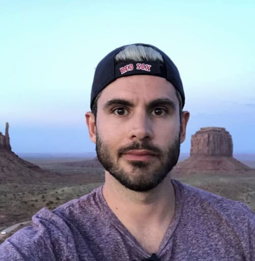 Man in Red Sox headband at Monument Valley, representing Manoir de la Nogrie property manager