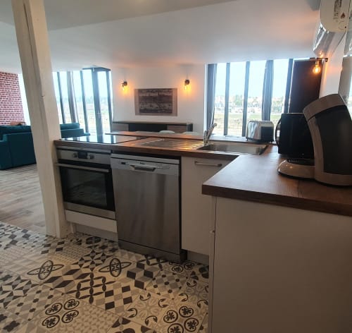 Modern kitchen in Gîte Le Relais Viennois cottage, Blois, with stainless steel appliances and river views