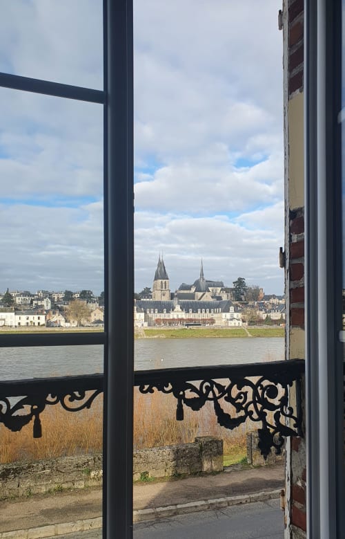 View from Gîte Des Cygnes window overlooking Loire River and Blois cathedral, France