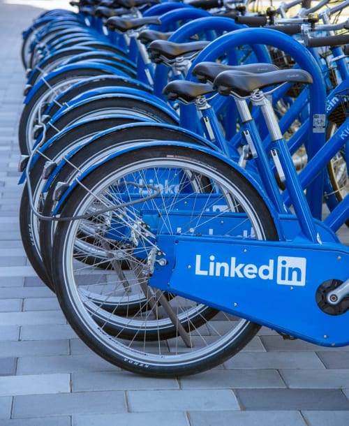 LinkedIn-branded blue bikes lined up at Au Gite d'Isigny in Isigny-sur-Mer, France