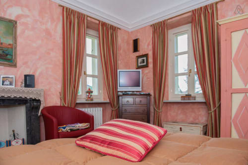 Red Room | Villa Mirano B&B, on the outskirts of Turin, with garden view. It offers a large private bathroom, a double bed, antique fireplace, wifi, desk, flat screen TV, DVD player, dining room, summer pool.