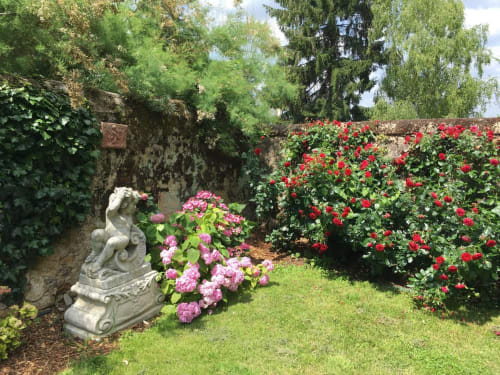 Flower garden with putti statue – Demeure Jousset des Berries