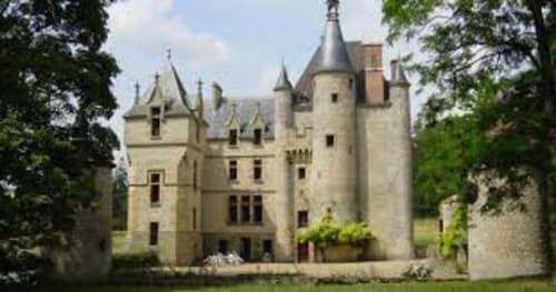 Château De Clusors, a historic French château B&B in St Menoux with towers and turrets surrounded by lush greenery