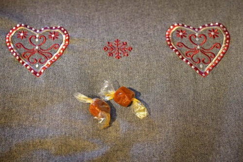 Festive holiday decorations: red embroidered hearts and candy in Chamrousse BnB room