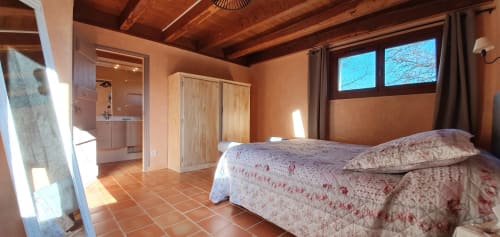 Main bedroom of Cristal Cottage with double bed and natural light.
