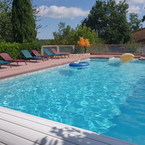 Colorful floats in the heated pool at Domaine du Cardou