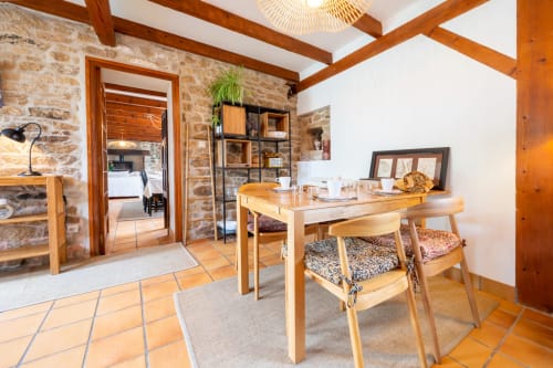 Spacious wooden desk area in Maison Berce at Espace Ker Gana B&B, Plourin, with stone walls and beamed ceiling